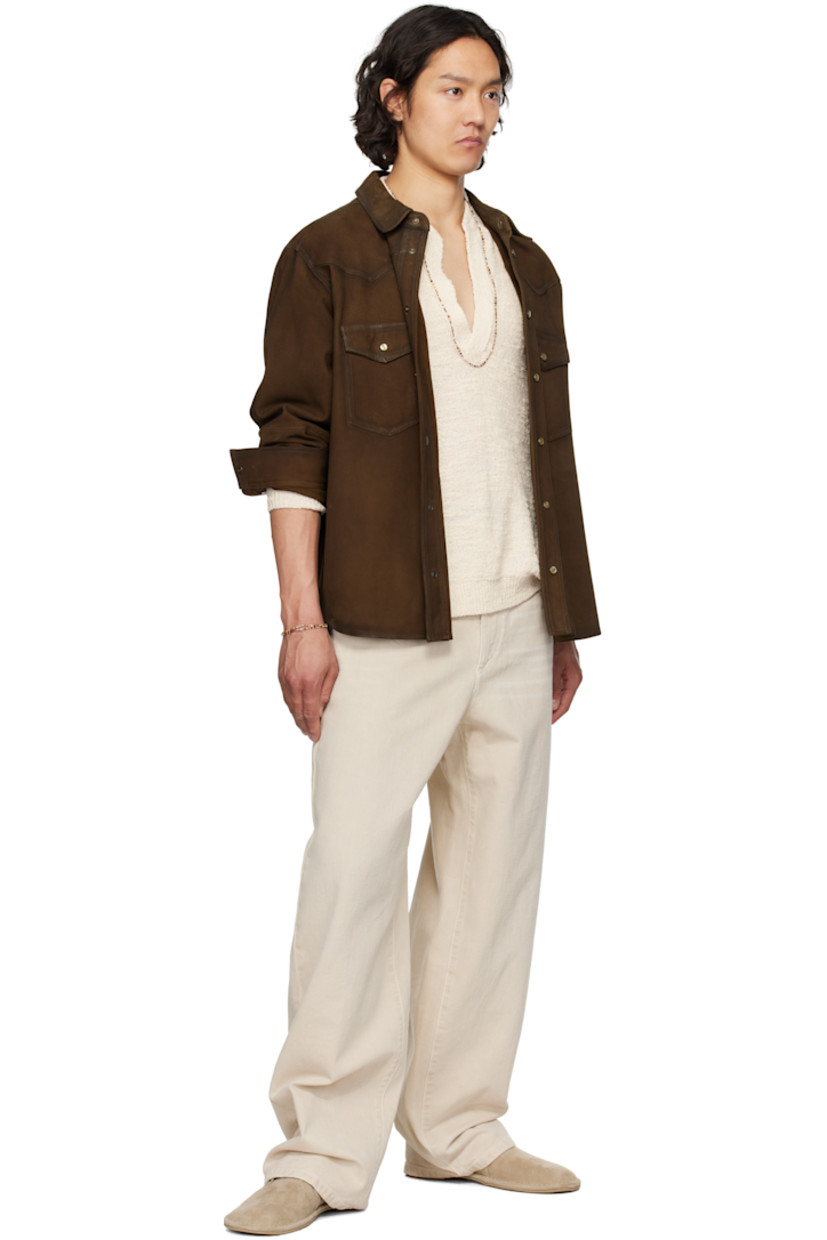 Goatskin suede shirt. Fading throughout. 

· Spread collar
· Press-stud closure
· Patch pockets
· Shirttail hem
· Buttoned barrel cuffs

Supplier color: Brown