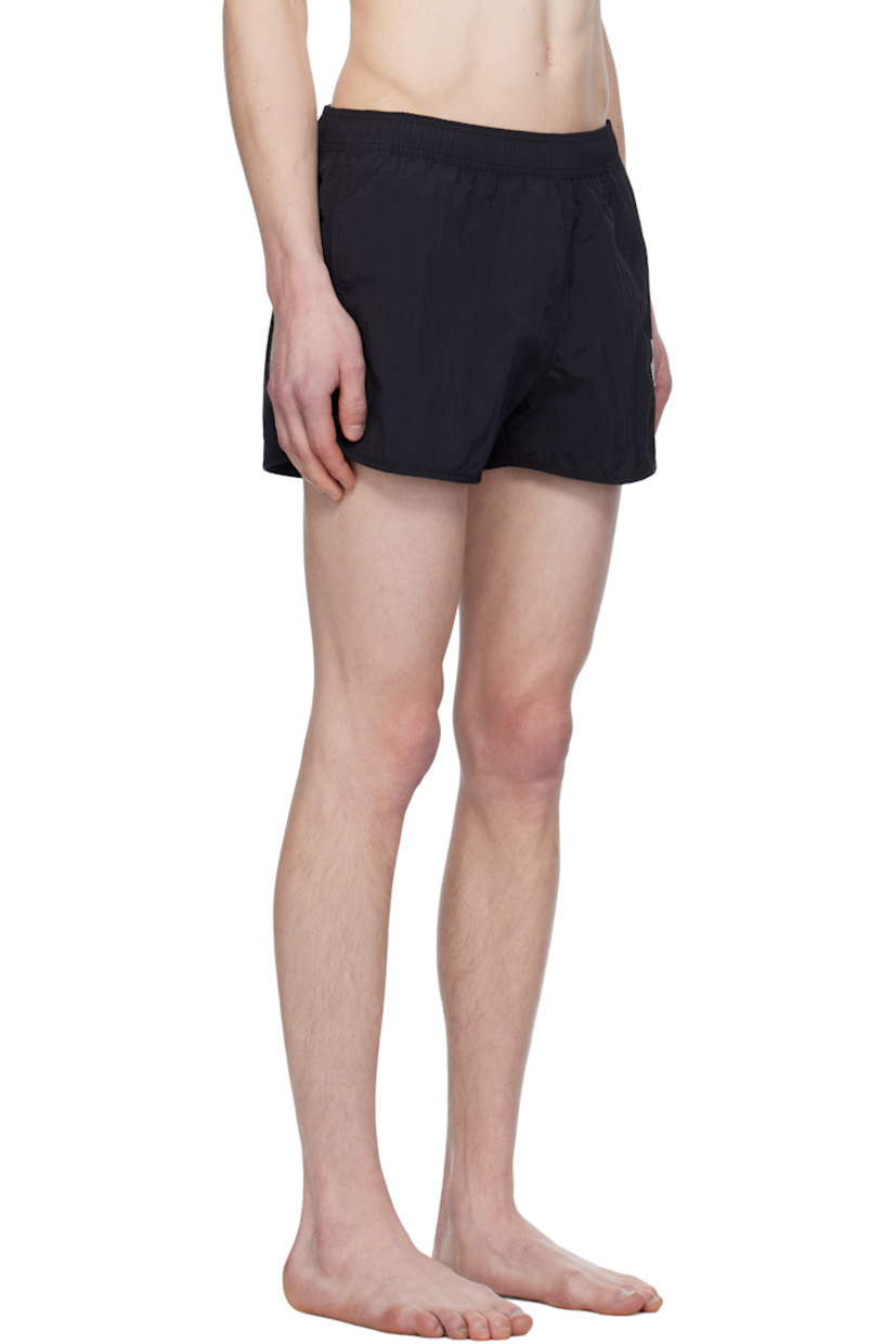 Polyester taffeta swim shorts. 

· Concealed drawstring at elasticized waistband
· Two-pocket styling
· Logo graphic embroidered at leg
· Vent at cuffs 
· Briefs-style mesh lining

Supplier color: Faded black