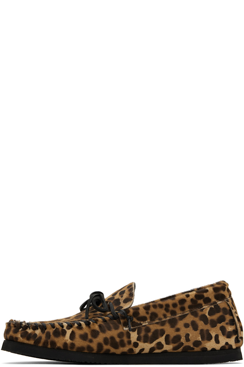 Calf-hair loafers in tan and brown.

· Leopard pattern throughout
· Whipstitching at moc toe
· Bow accent at vamp
· Pinched seams at heel counter
· Calfskin nubuck lining
· Crêpe rubber sole

Supplier color: Leopard