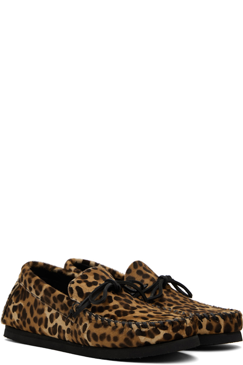 Calf-hair loafers in tan and brown.

· Leopard pattern throughout
· Whipstitching at moc toe
· Bow accent at vamp
· Pinched seams at heel counter
· Calfskin nubuck lining
· Crêpe rubber sole

Supplier color: Leopard