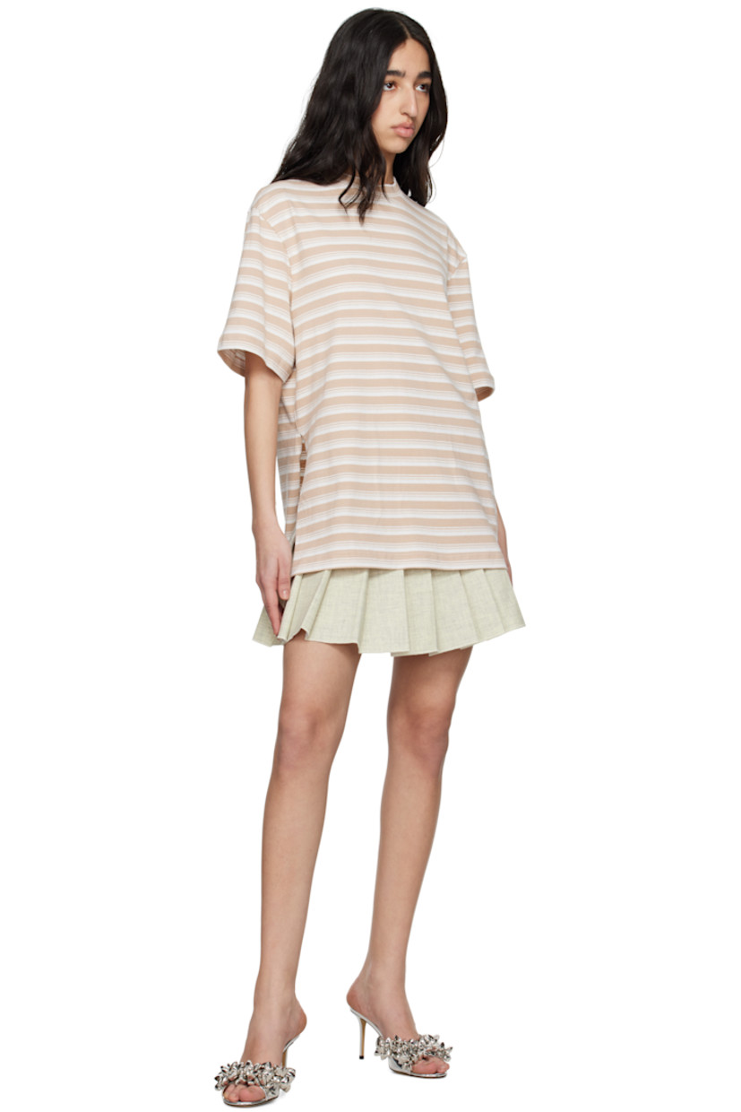 Plain-woven cotton- and wool-blend miniskirt. 

· Wrap construction
· Knife pleats at front
· Belt loops
· Offset button closure 
· Satin lining

Supplier color: Beige