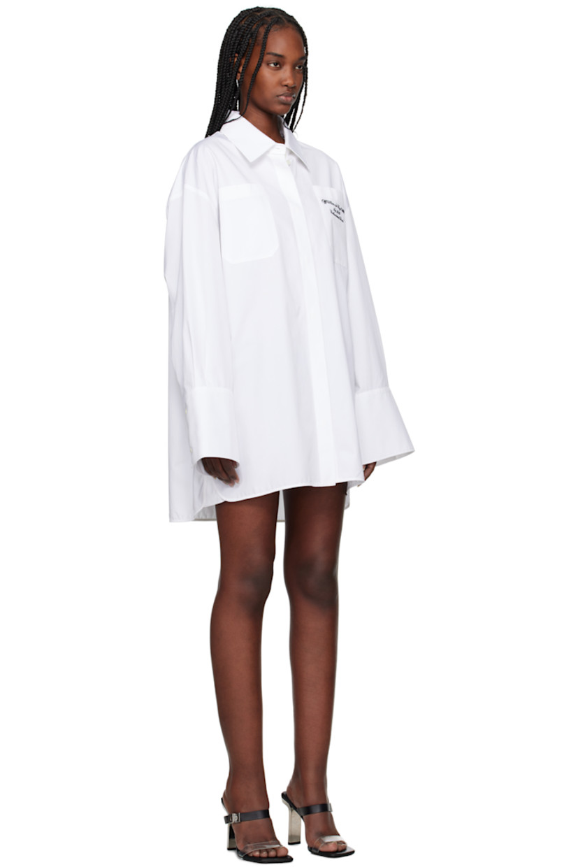 Cotton poplin shirt-style minidress. 

· Spread collar
· Button closure
· Logo and text embroidered at patch pocket
· Shirttail hem
· Logo flag at side seam
· Dropped shoulders
· Pleated single-button barrel cuffs

Supplier color: White/Black