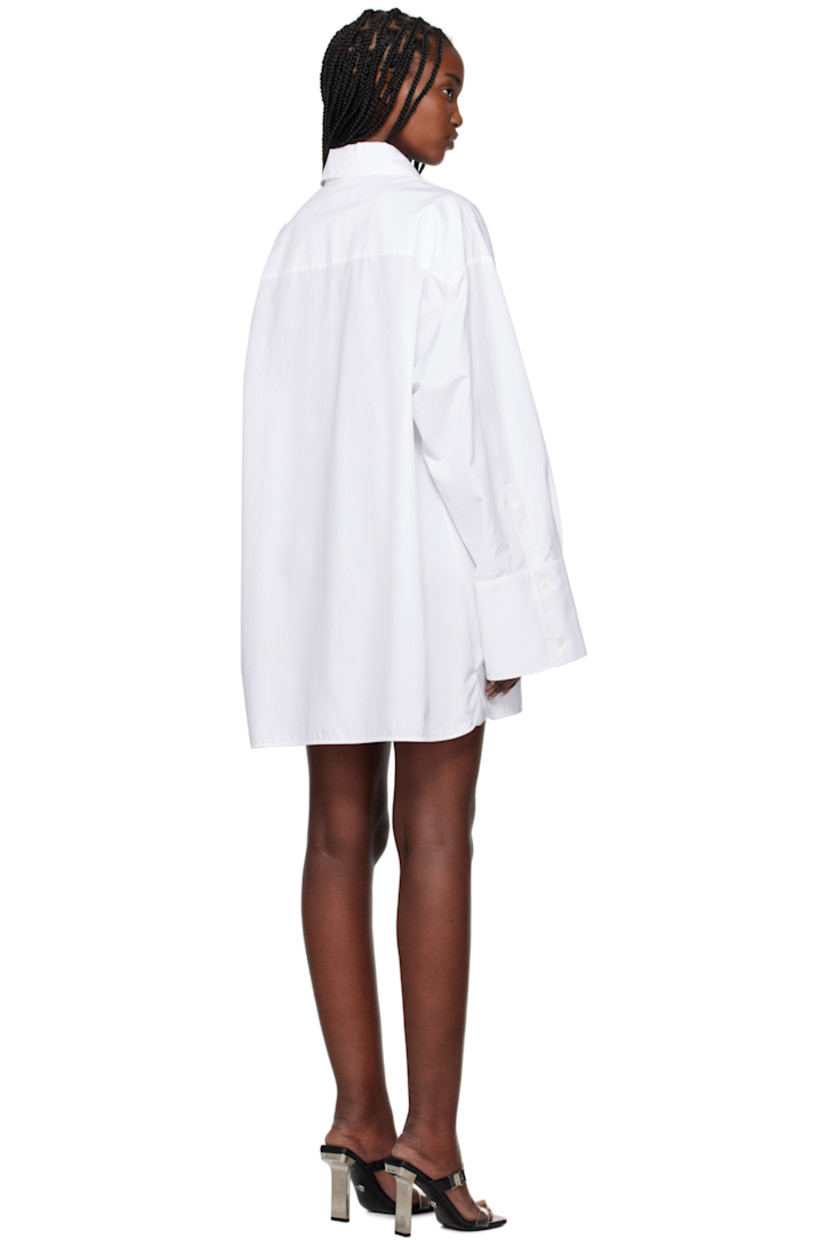 Cotton poplin shirt-style minidress. 

· Spread collar
· Button closure
· Logo and text embroidered at patch pocket
· Shirttail hem
· Logo flag at side seam
· Dropped shoulders
· Pleated single-button barrel cuffs

Supplier color: White/Black