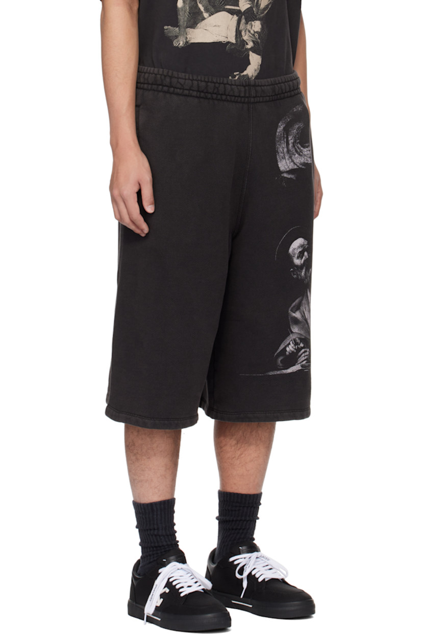 Garment-dyed French terry shorts. Fading throughout.

· Concealed drawstring at elasticized waistband
· Two-pocket styling 
· Graphics printed at front and back
· Logo graphic embroidered at back legs

Supplier color: Black/Grey