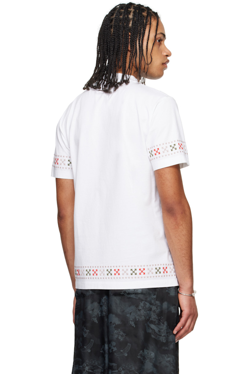Slim-fit cotton jersey T-shirt.

· Rib-knit crewneck
· Logo embroidered at chest
· Graphic printed at front
· Logo graphic pattern embroidered at hem and cuffs

Supplier color: White