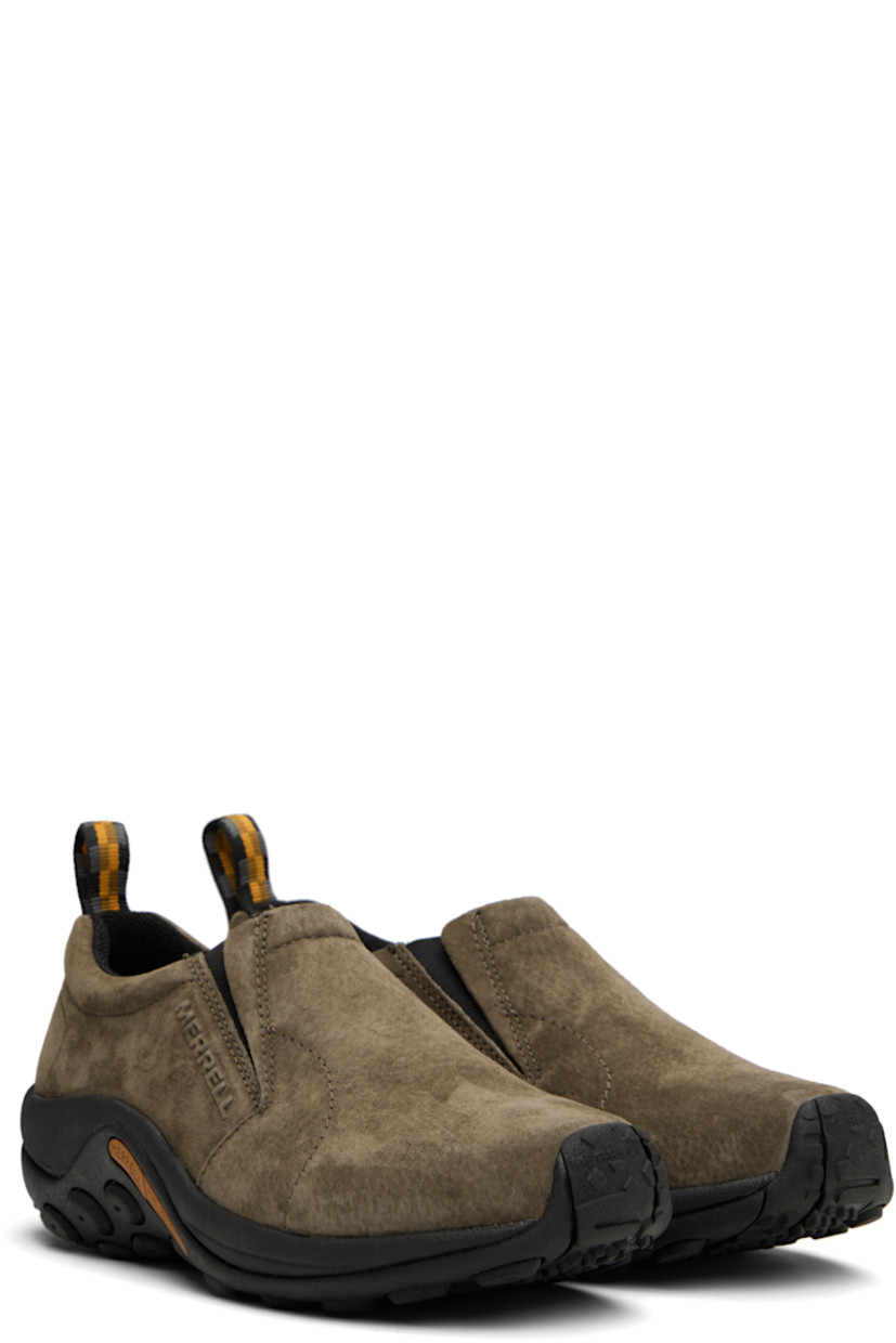 Low-top pigskin suede slip-on sneakers in gray.

· Elasticized gusset at padded tongue
· Padded collar
· Logo embossed at outer side
· Pull-loop at heel tab
· Jersey lining
· Merrell M Select™ FIT.ECO molded footbed
· Merrell Air Cushion at heel midsole
· Treaded Kinetic Fit™ BASE rubber sole

Supplier color: Gunsmoke