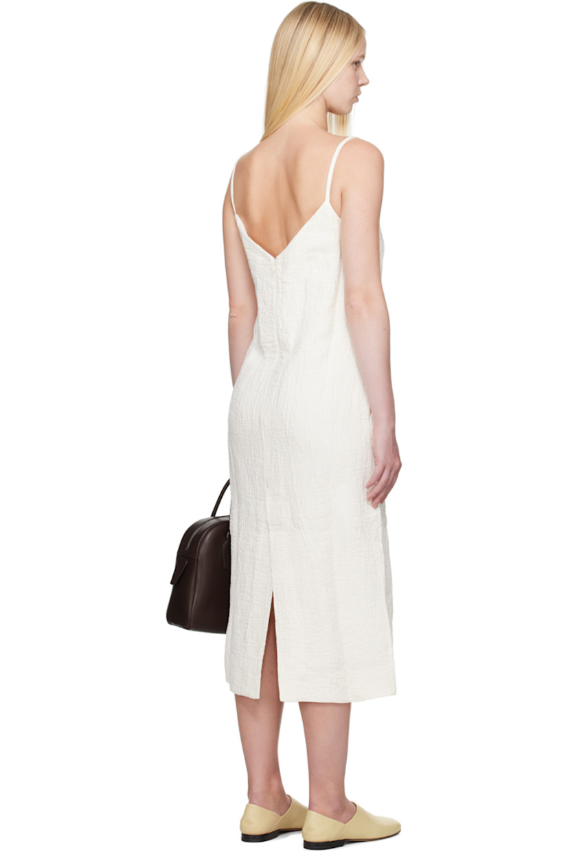 Textured linen- and cotton-blend double-gauze midi dress.

· Square neck
· Seam pockets
· Fixed spaghetti straps
· Concealed zip closure at back
· Central vent at back hem
· Full viscose-blend twill lining

Supplier color: Parchment