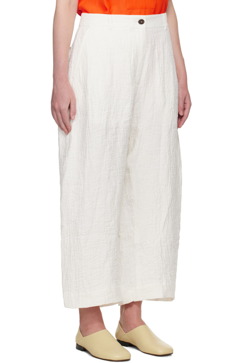 Textured linen- and cotton-blend double-gauze trousers.

· Wide-leg
· Belt loops
· Four-pocket styling
· Zip fly
· Dropped inseam
· Cropped legs
· Curved outseams

Supplier color: Parchment