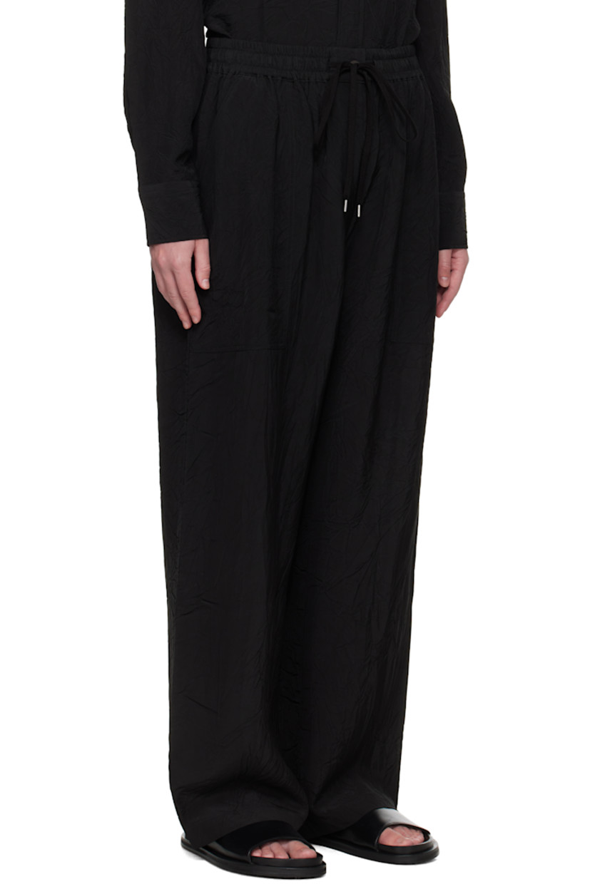 Crinkled plain-woven viscose trousers. 

· Drawstring at elasticized waistband
· Three-pocket styling
· Mock fly

Supplier color: Black