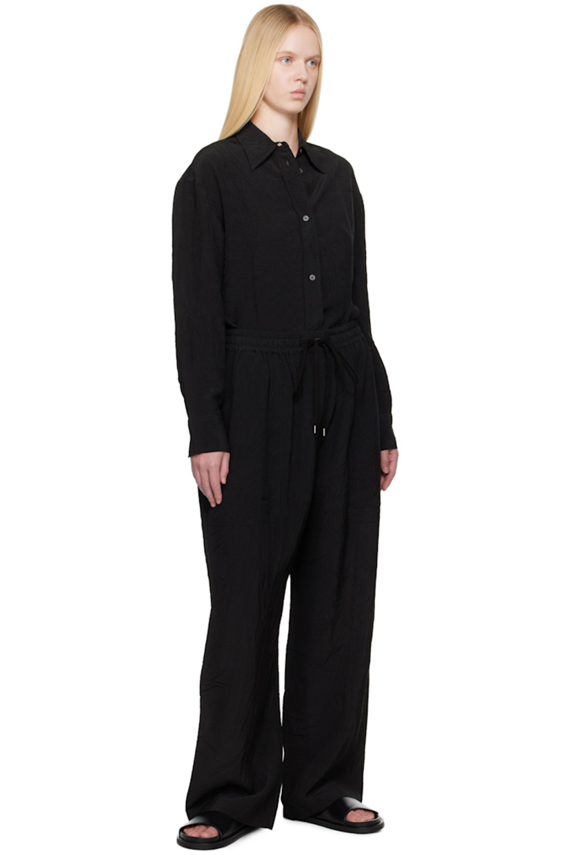 Crinkled plain-woven viscose trousers. 

· Drawstring at elasticized waistband
· Three-pocket styling
· Mock fly

Supplier color: Black