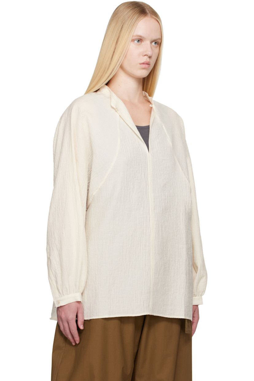 Oversized cotton- and nylon-blend matelassé shirt.

· Button keyhole at band collar
· Raglan sleeves
· Buttoned cuffs
· Mother-of-pearl hardware

Supplier color: Milk