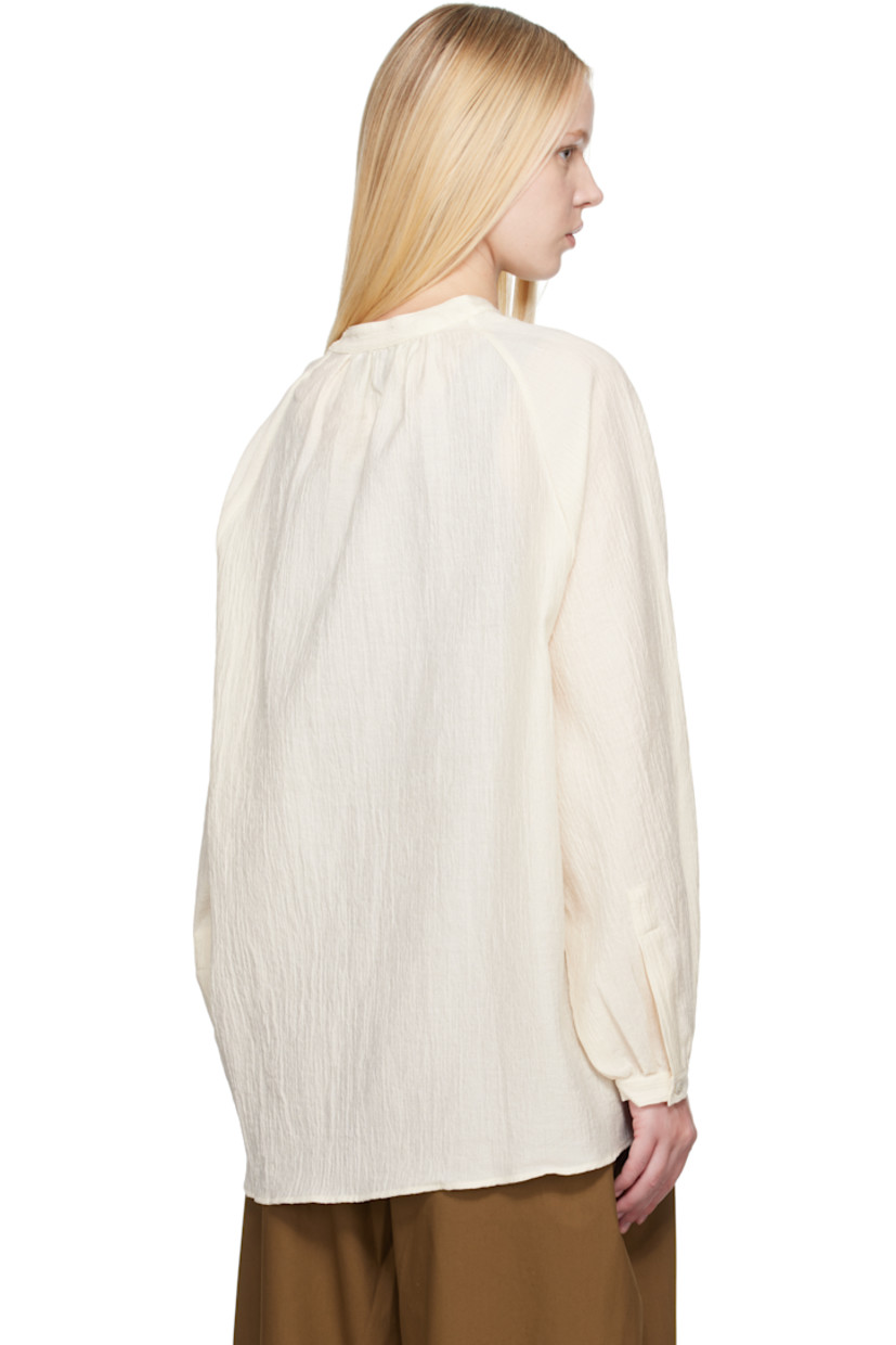 Oversized cotton- and nylon-blend matelassé shirt.

· Button keyhole at band collar
· Raglan sleeves
· Buttoned cuffs
· Mother-of-pearl hardware

Supplier color: Milk