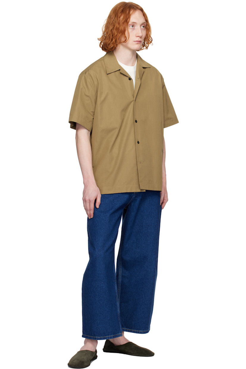 Wide-leg 14 oz non-stretch regenerative cotton-blend denim jeans. 

· Belt loops
· Five-pocket styling
· Zip fly
· Leather logo patch at back waistband
· Contrast stitching in tan

Supplier color: Indigo wash