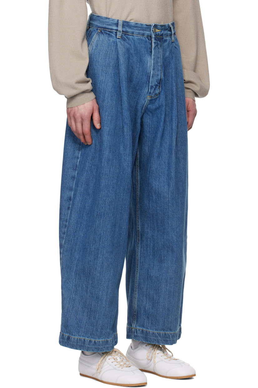 Oversized wide-leg non-stretch cotton-blend denim jeans. Fading throughout. 

· Pre-washed and garment-dyed 
· Belt loops
· Four-pocket styling
· Zip-fly
· Pleats at front
· Contrast stitching in tan

Supplier color: Faded indigo