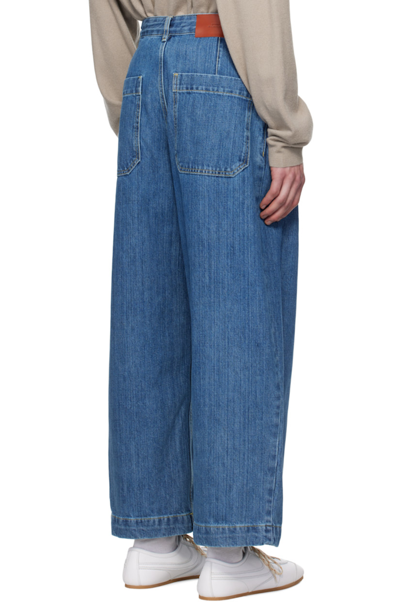 Oversized wide-leg non-stretch cotton-blend denim jeans. Fading throughout. 

· Pre-washed and garment-dyed 
· Belt loops
· Four-pocket styling
· Zip-fly
· Pleats at front
· Contrast stitching in tan

Supplier color: Faded indigo
