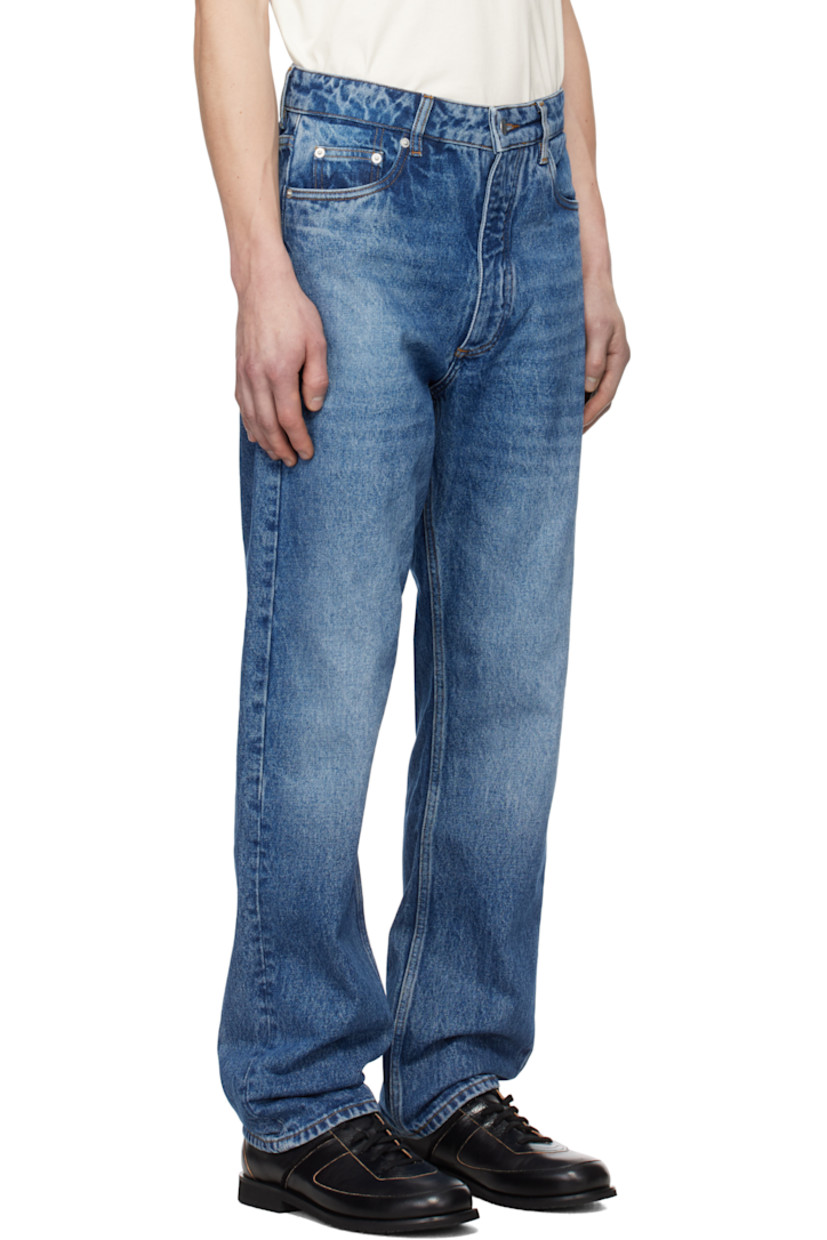 Straight-leg non-stretch regenerative cotton-blend denim jeans. Fading and whiskering throughout. 

· Pre-washed 
· Mid-rise
· Belt loops
· Five-pocket styling
· Zip-fly
· Leather logo patch at back waistband

Supplier color: Worn wash indigo