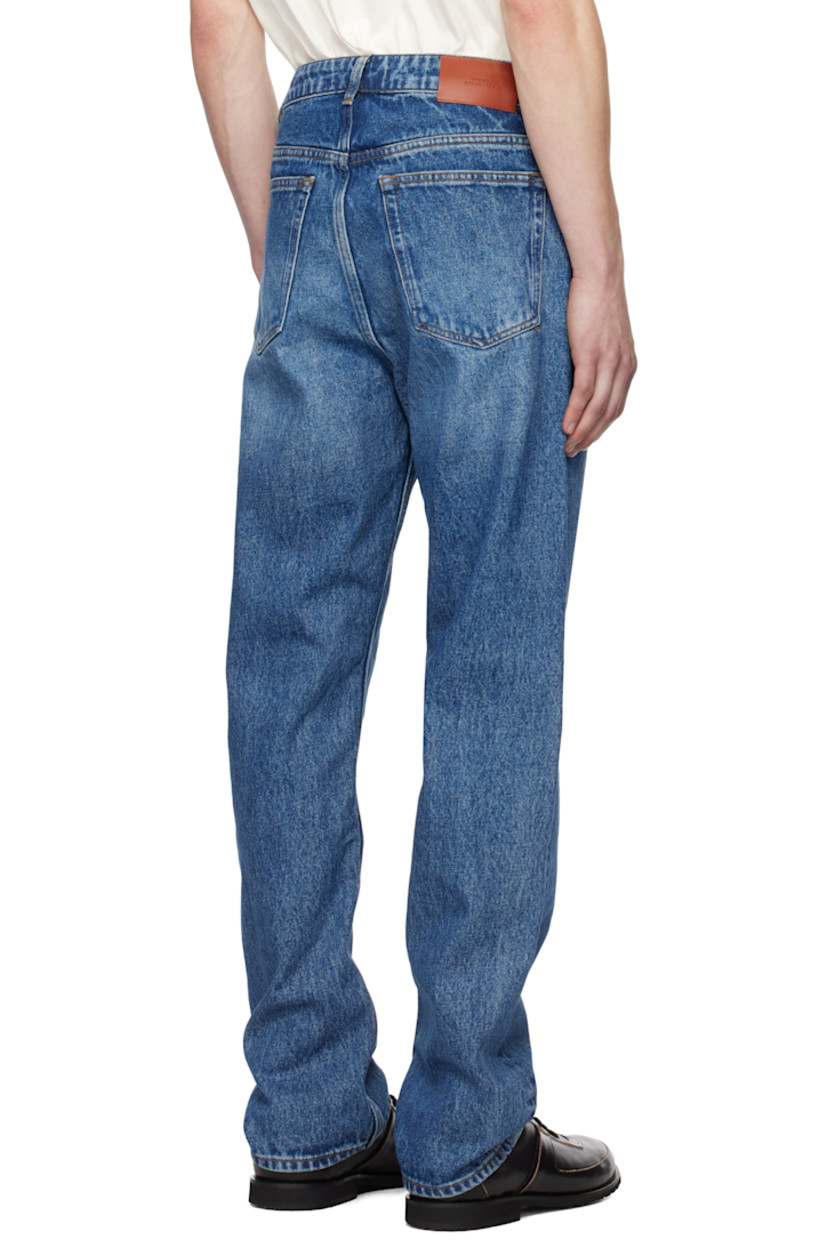 Straight-leg non-stretch regenerative cotton-blend denim jeans. Fading and whiskering throughout. 

· Pre-washed 
· Mid-rise
· Belt loops
· Five-pocket styling
· Zip-fly
· Leather logo patch at back waistband

Supplier color: Worn wash indigo