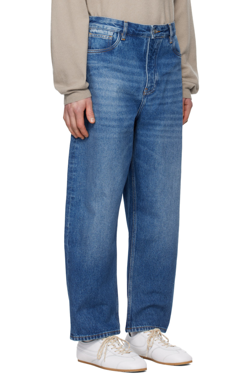 Oversized non-stretch regenerative cotton-blend denim jeans.

· Wide-leg 
· Mid-rise
· Belt loops
· Five-pocket styling
· Zip-fly
· Leather logo patch at back waistband

Supplier color: Worn wash indigo
