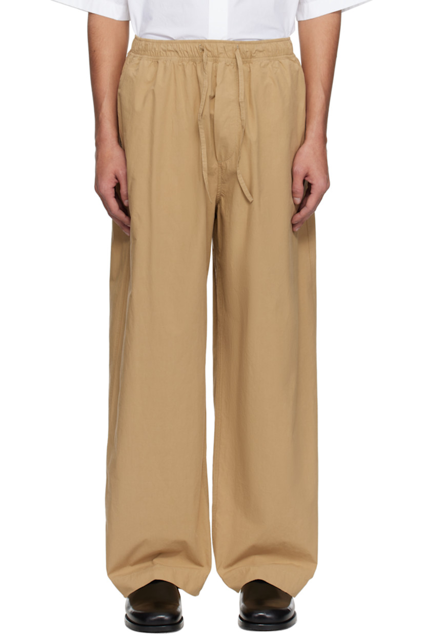 Loose-fit peached cotton twill trousers.

· Drawstring at elasticized waistband
· Four-pocket styling
· Mock fly 
· Curved outseams

Supplier color: Sand