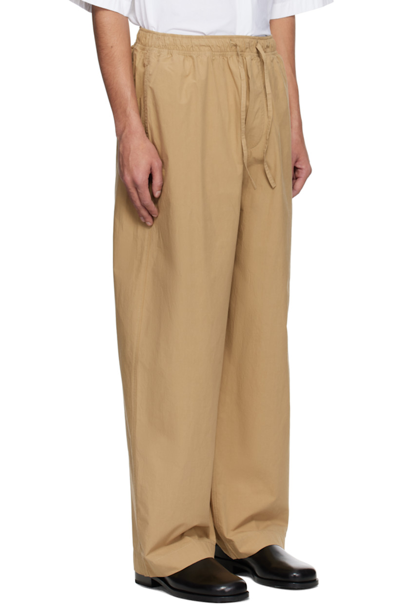 Loose-fit peached cotton twill trousers.

· Drawstring at elasticized waistband
· Four-pocket styling
· Mock fly 
· Curved outseams

Supplier color: Sand