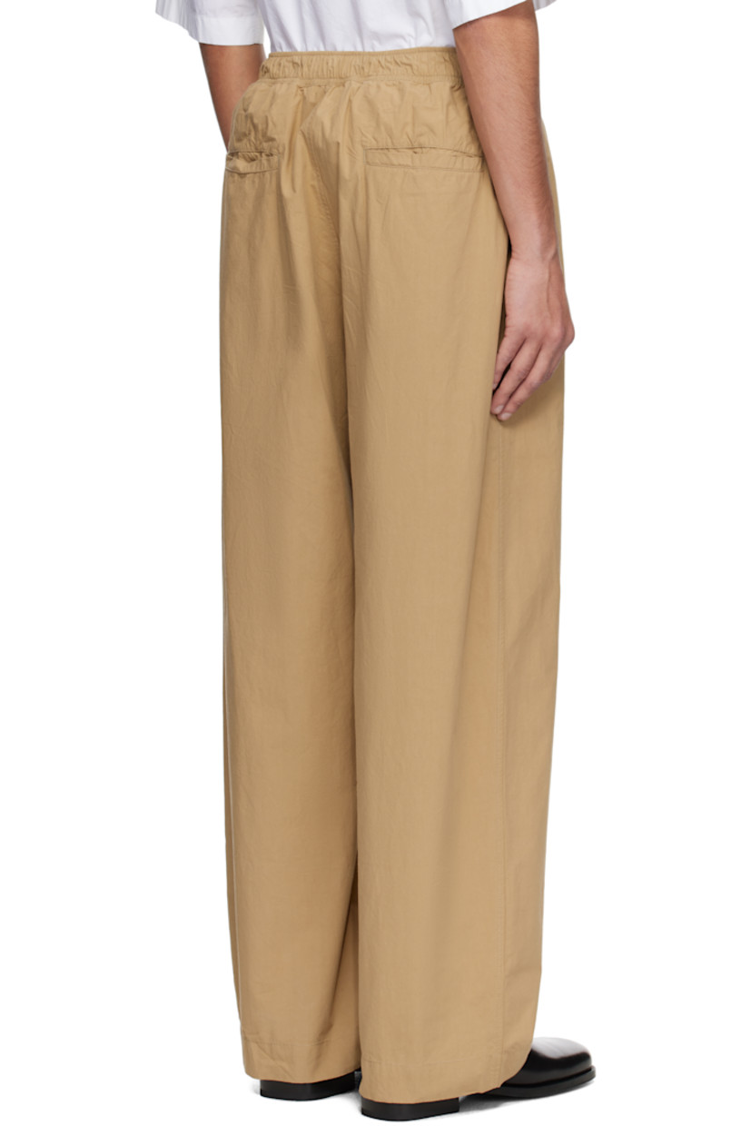 Loose-fit peached cotton twill trousers.

· Drawstring at elasticized waistband
· Four-pocket styling
· Mock fly 
· Curved outseams

Supplier color: Sand