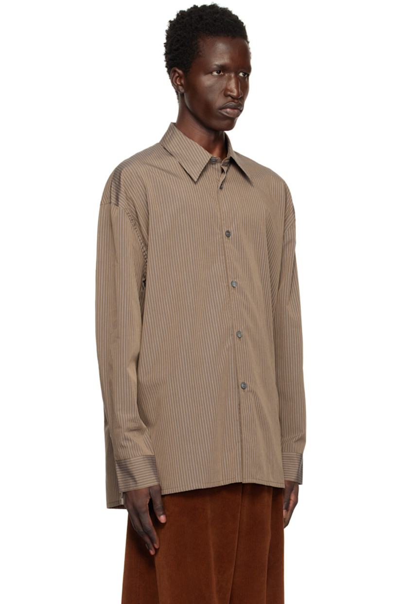 Cotton poplin shirt. Pinstripes throughout.

· Spread collar
· Button closure
· Vented side seams
· Dropped shoulders
· Pleated single-button barrel cuffs

Supplier color: Toffee stripe