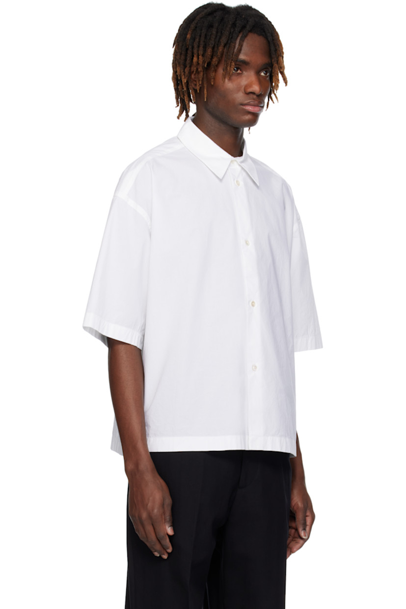 Loose-fit organic cotton poplin shirt.

· Spread collar
· Button closure
· Dropped shoulders
· Twin pleats at yoke

Supplier color: Optic white