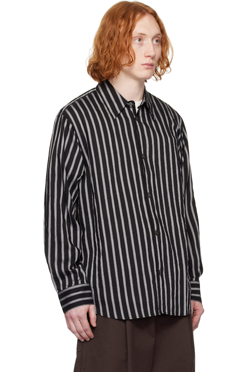 Oversized lyocell- and nylon-blend poplin shirt. Stripes throughout.

· Boxy-fit
· Spread collar
· Button closure
· Shirttail hem
· Dropped shoulders
· Pleat at single-button barrel cuffs
· Twin pleats at back yoke

Supplier color: Darkest navy