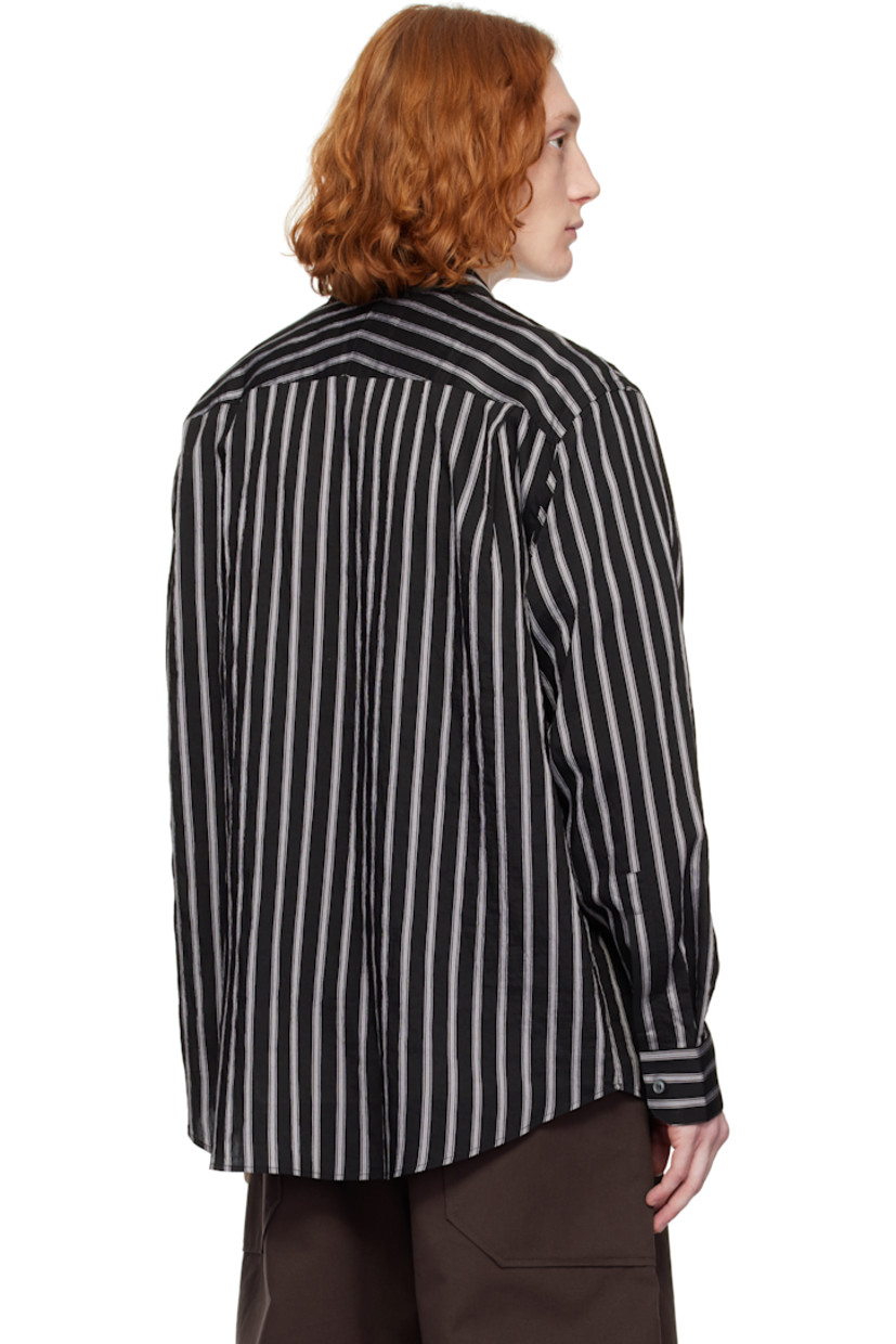Oversized lyocell- and nylon-blend poplin shirt. Stripes throughout.

· Boxy-fit
· Spread collar
· Button closure
· Shirttail hem
· Dropped shoulders
· Pleat at single-button barrel cuffs
· Twin pleats at back yoke

Supplier color: Darkest navy