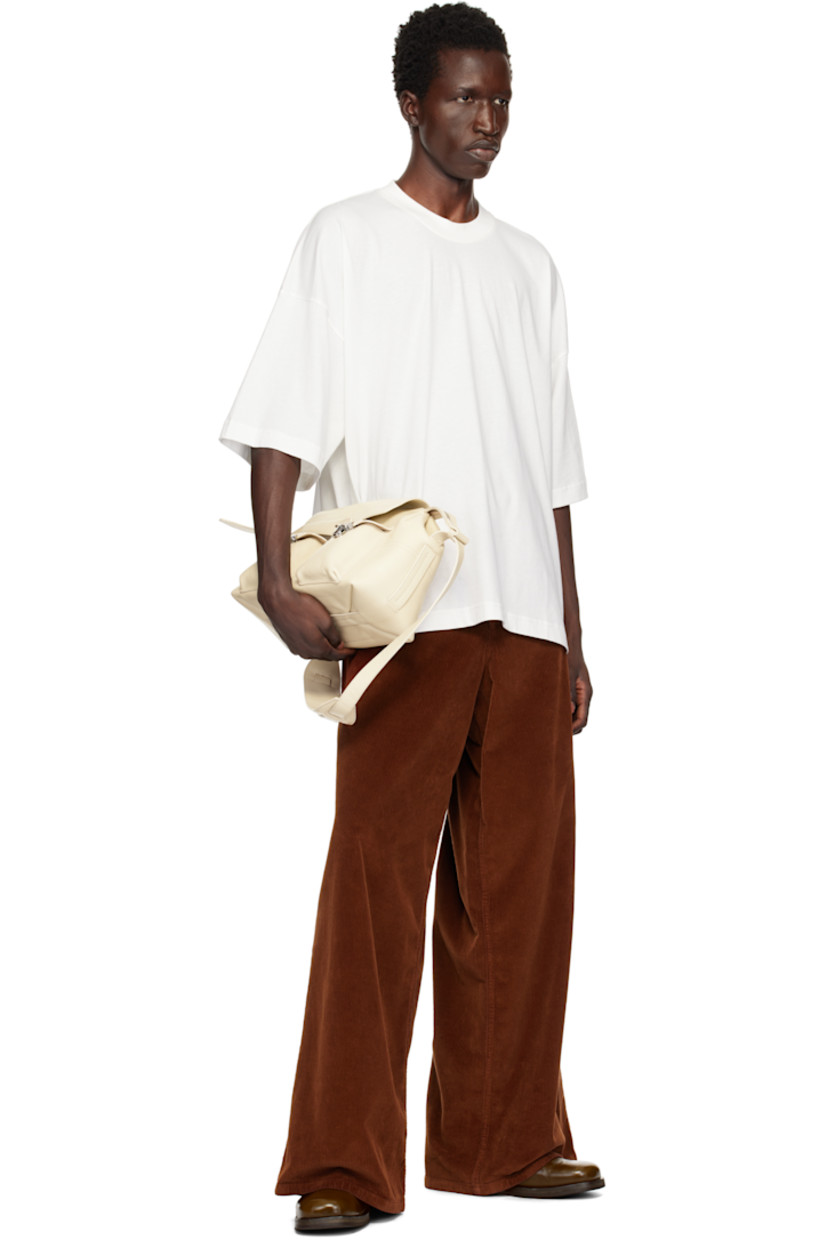 Cotton jersey T-shirt.

· Rib-knit crewneck
· Dropped shoulders
· Logo printed at back collar

Supplier color: Off white