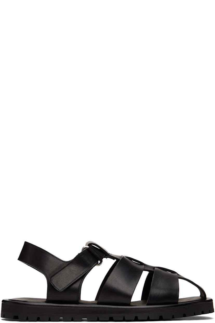 Buffed calfskin flat sandals in black.

· Velcro ankle strap
· Logo stamp at padded footbed
· Buffed leather lining
· Treaded Vibram® rubber sole

Supplier color: Black