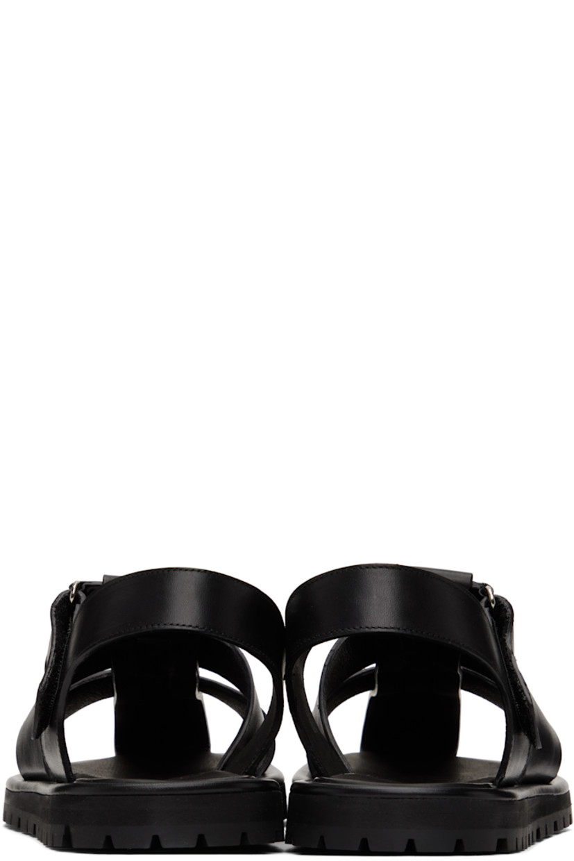 Buffed calfskin flat sandals in black.

· Velcro ankle strap
· Logo stamp at padded footbed
· Buffed leather lining
· Treaded Vibram® rubber sole

Supplier color: Black