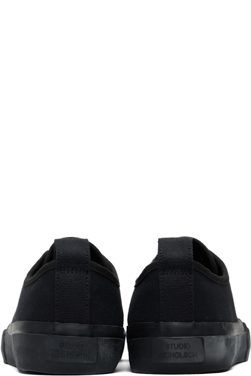 Low-top cotton canvas sneakers in navy.

· Textured rubber cap toe
· Lace-up closure
· Pull-loop at heel collar
· Twill lining
· Treaded vulcanized rubber sole

Supplier color: Darkest navy
