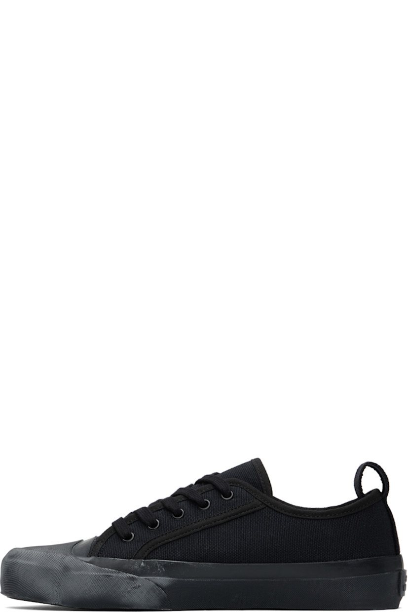 Low-top cotton canvas sneakers in navy.

· Textured rubber cap toe
· Lace-up closure
· Pull-loop at heel collar
· Twill lining
· Treaded vulcanized rubber sole

Supplier color: Darkest navy