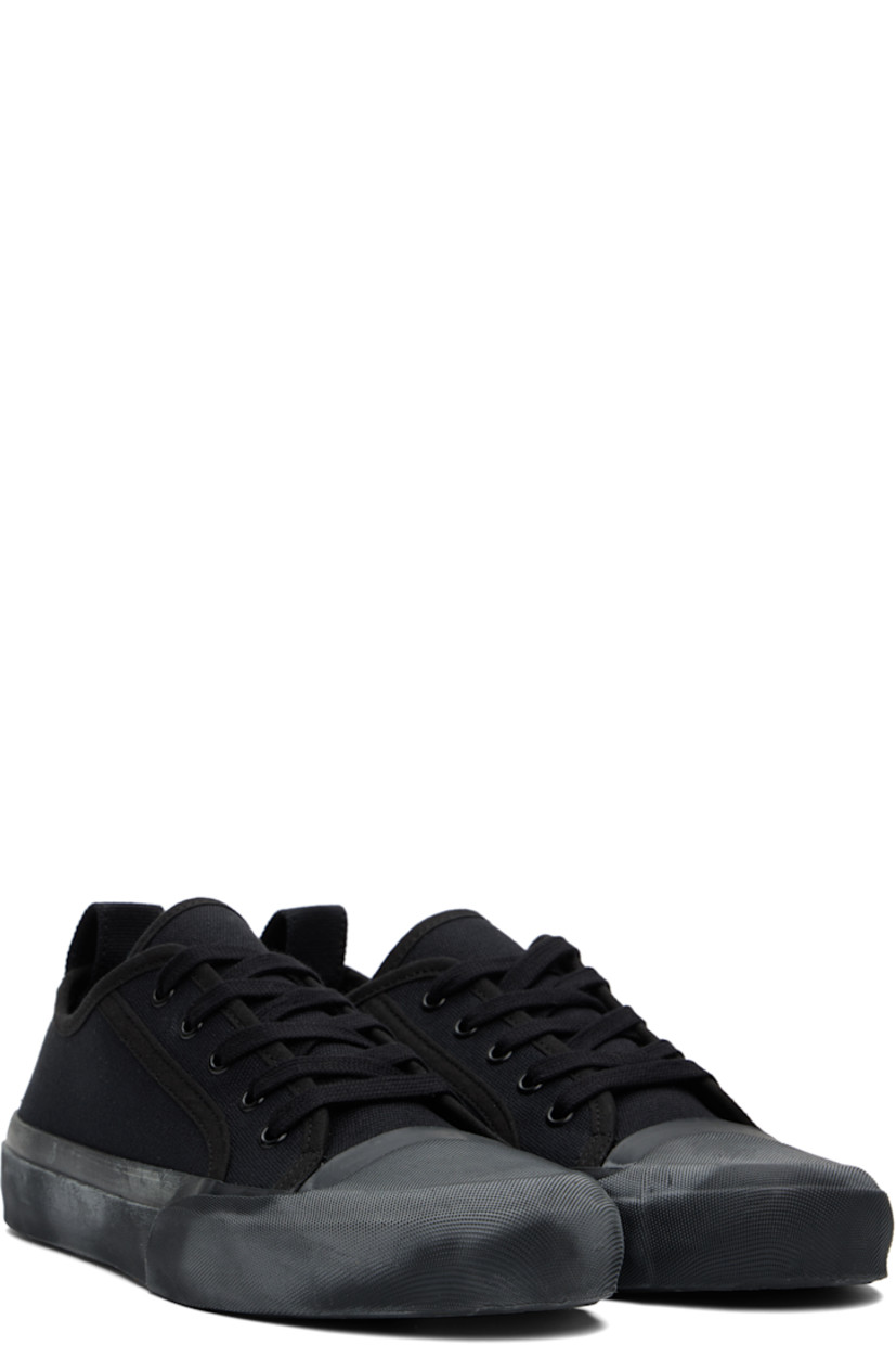 Low-top cotton canvas sneakers in navy.

· Textured rubber cap toe
· Lace-up closure
· Pull-loop at heel collar
· Twill lining
· Treaded vulcanized rubber sole

Supplier color: Darkest navy