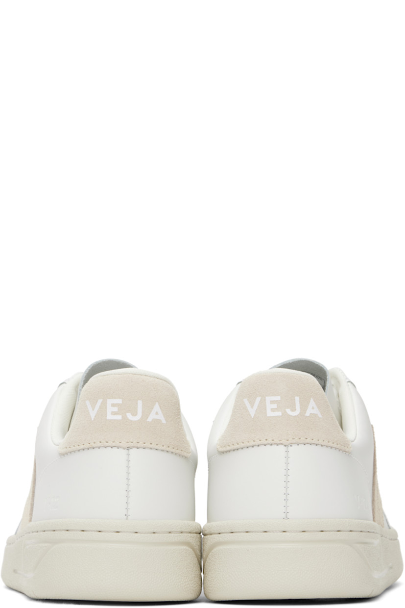 Low-top buffed leather sneakers in white.

· Lace-up closure
· Logo embossed at tongue
· Padded collar
· Suede logo appliqué at sides
· Text embossed at outer side
· Logo printed at suede heel tab
· Recycled polyester jersey lining
· Treaded rubber sole

Supplier color: Extra-white/Sable