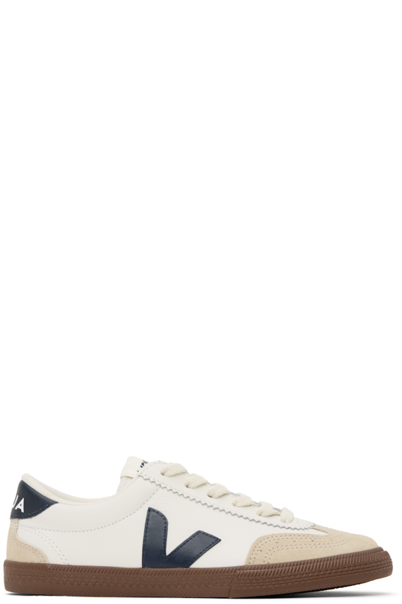 Low-top grained organic leather and suede sneakers in white. 

· Perforated detailing at toe
· Serrated trim at lace-up closure
· Logo patch at padded tongue
· Padded collar
· Logo appliqué at sides
· Logo printed at heel tab
· Recycled polyester jersey lining
· Treaded rubber sole

Supplier color: White/Nautico/Bark