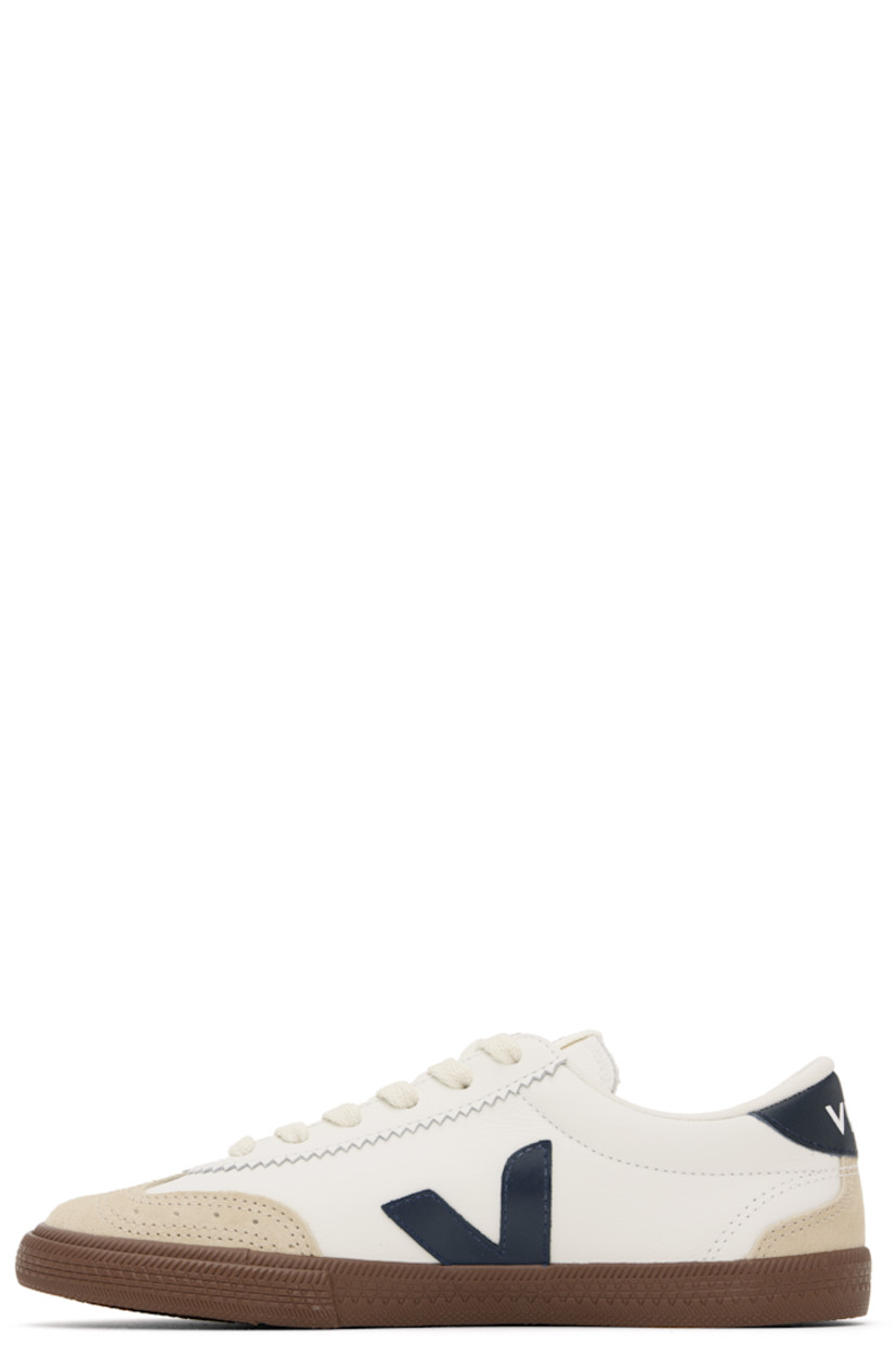 Low-top grained organic leather and suede sneakers in white. 

· Perforated detailing at toe
· Serrated trim at lace-up closure
· Logo patch at padded tongue
· Padded collar
· Logo appliqué at sides
· Logo printed at heel tab
· Recycled polyester jersey lining
· Treaded rubber sole

Supplier color: White/Nautico/Bark