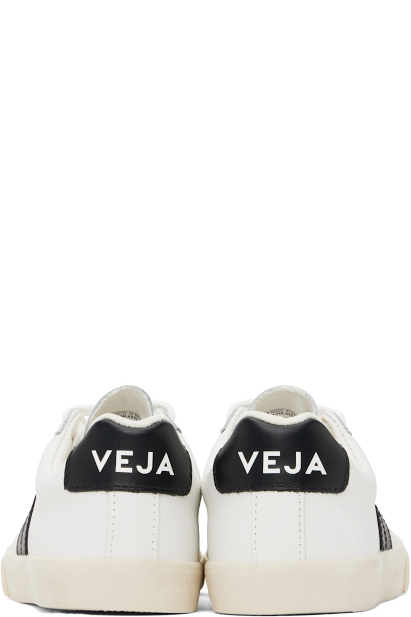 Low-top buffed leather sneakers in white. 

· Lace-up closure
· Logo printed at tongue
· Padded collar
· Logo appliqué at sides
· Logo printed at heel tab
· Recycled polyester jersey lining
· Treaded rubber sole

Supplier color: White/Black