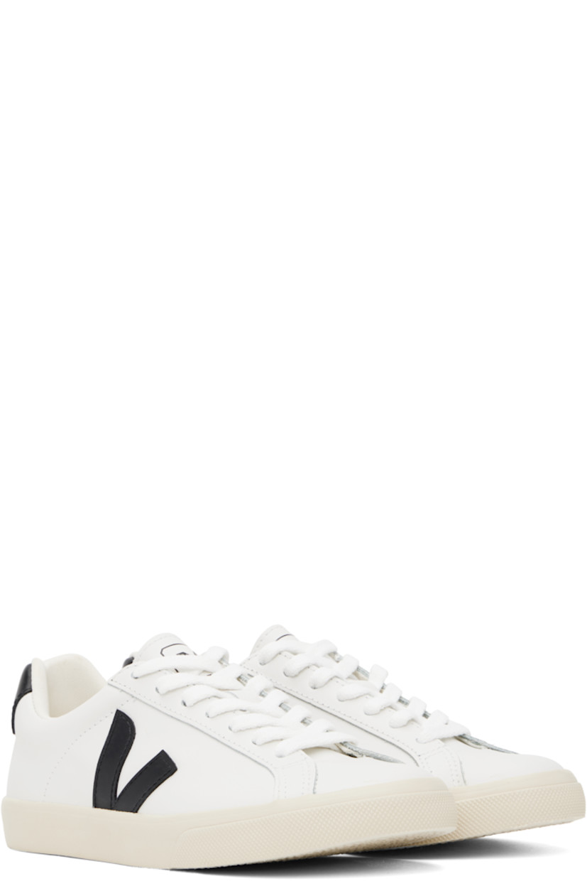 Low-top buffed leather sneakers in white. 

· Lace-up closure
· Logo printed at tongue
· Padded collar
· Logo appliqué at sides
· Logo printed at heel tab
· Recycled polyester jersey lining
· Treaded rubber sole

Supplier color: White/Black