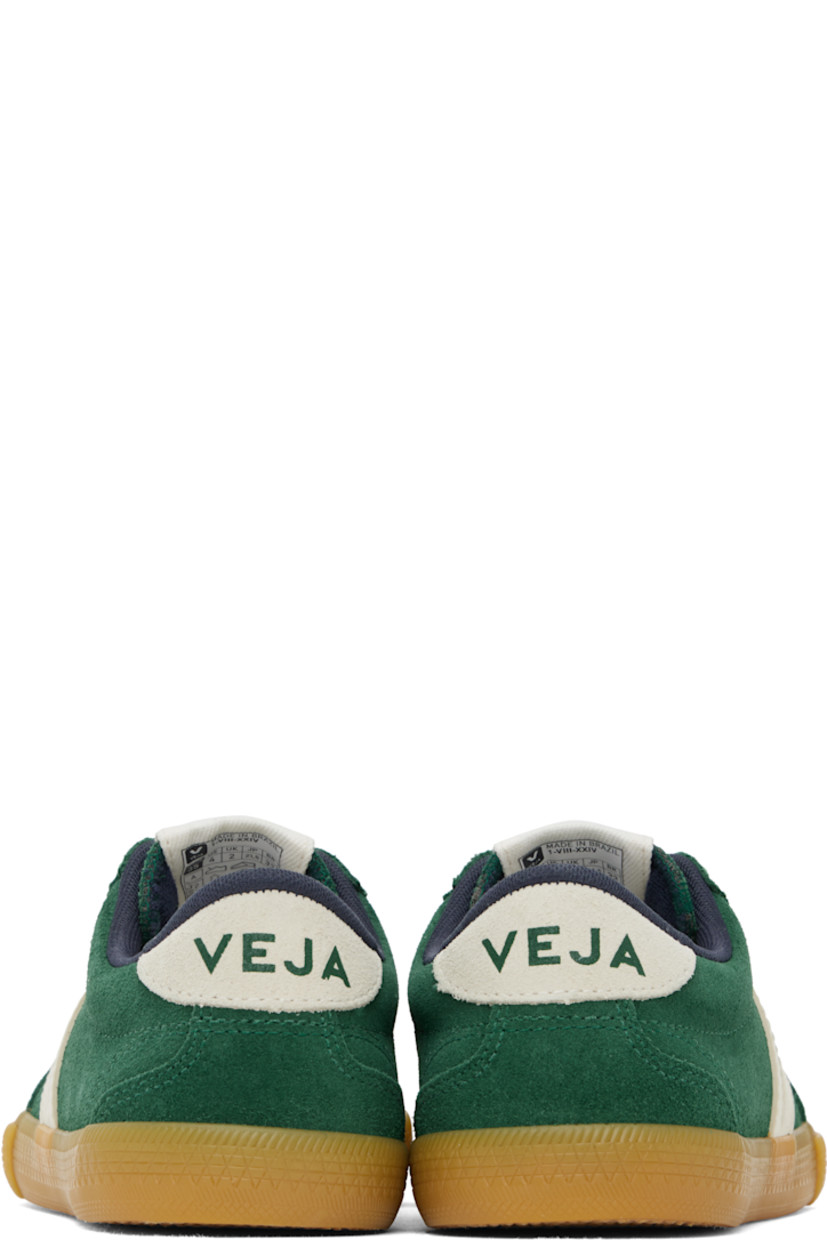 Low-top suede and ChromeFree buffed leather sneakers in green. 

· Water-repellent, non-PFC coating
· Perforated detailing at toe
· Serrated trim at lace-up closure
· Logo patch at padded tongue
· Padded collar
· Rubberized logo appliqué at sides
· Logo printed at heel tab
· Recycled polyester jersey lining
· Treaded rubber sole

Supplier color: Poker/Pierre