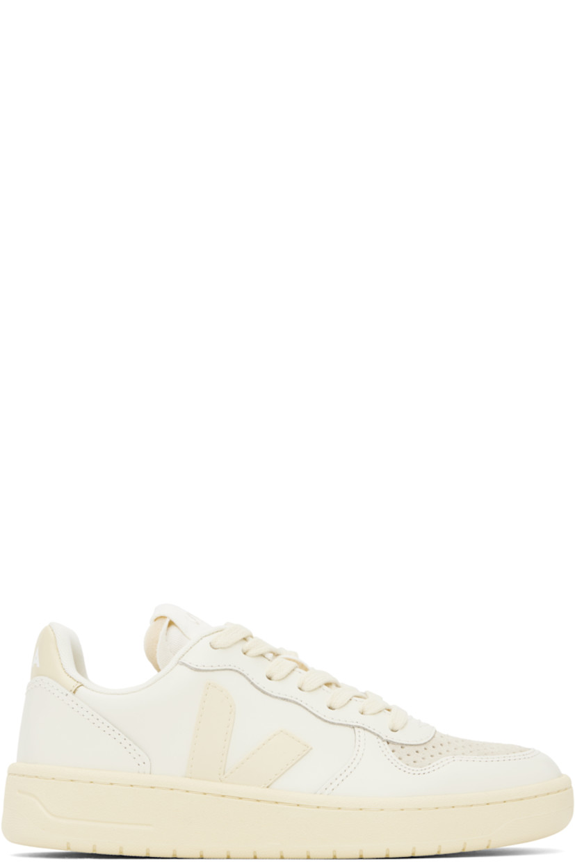 Low-top buffed leather sneakers in off-white.

· Suede trim and perforations at toe
· Lace-up closure
· Logo patch at padded tongue
· Padded collar
· Rubberized logo appliqué at sides
· Logo printed at heel tab
· Recycled polyester jersey lining
· Treaded rubber sole

Supplier color: Pure/Calcaire