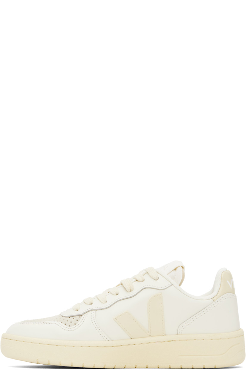 Low-top buffed leather sneakers in off-white.

· Suede trim and perforations at toe
· Lace-up closure
· Logo patch at padded tongue
· Padded collar
· Rubberized logo appliqué at sides
· Logo printed at heel tab
· Recycled polyester jersey lining
· Treaded rubber sole

Supplier color: Pure/Calcaire