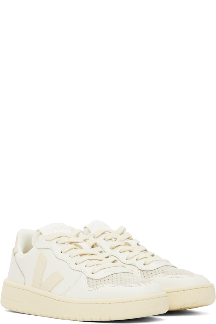 Low-top buffed leather sneakers in off-white.

· Suede trim and perforations at toe
· Lace-up closure
· Logo patch at padded tongue
· Padded collar
· Rubberized logo appliqué at sides
· Logo printed at heel tab
· Recycled polyester jersey lining
· Treaded rubber sole

Supplier color: Pure/Calcaire