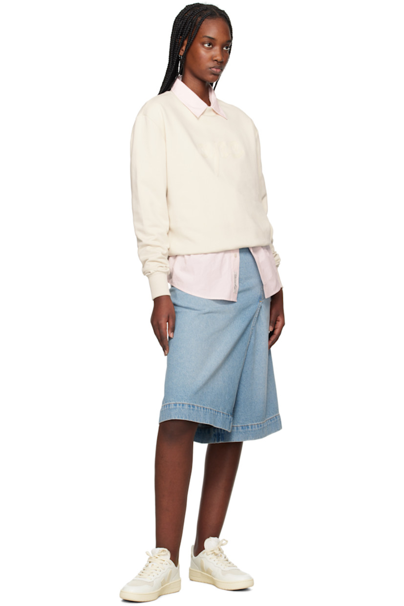 Low-top buffed leather sneakers in off-white.

· Suede trim and perforations at toe
· Lace-up closure
· Logo patch at padded tongue
· Padded collar
· Rubberized logo appliqué at sides
· Logo printed at heel tab
· Recycled polyester jersey lining
· Treaded rubber sole

Supplier color: Pure/Calcaire
