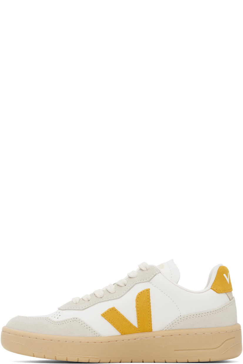 Low-top grained organic leather and suede sneakers in white.

· Suede trim in off-white throughout
· Perforations at toe
· Lace-up closure
· Logo printed at padded tongue
· Padded collar
· Logo appliqué at sides
· Text embossed at outer side
· Logo printed at heel tab
· Recycled polyester jersey lining
· Treaded rubber sole

Supplier color: Extra-white/Toscane/Natural