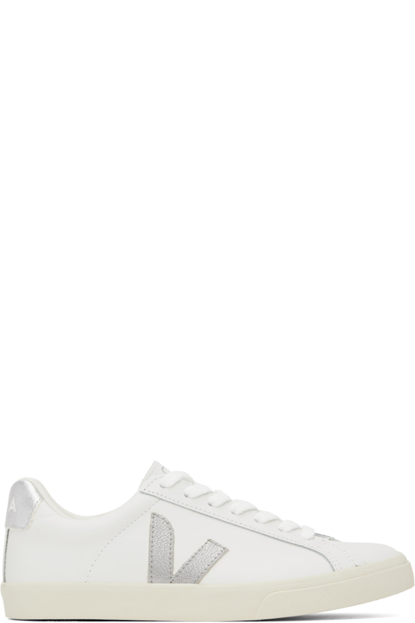 Low-top buffed leather sneakers in white. 

· Lace-up closure
· Logo printed at tongue
· Padded collar
· Logo appliqué at sides
· Logo printed at heel tab
· Recycled polyester jersey lining
· Treaded rubber sole

Supplier color: White/Silver