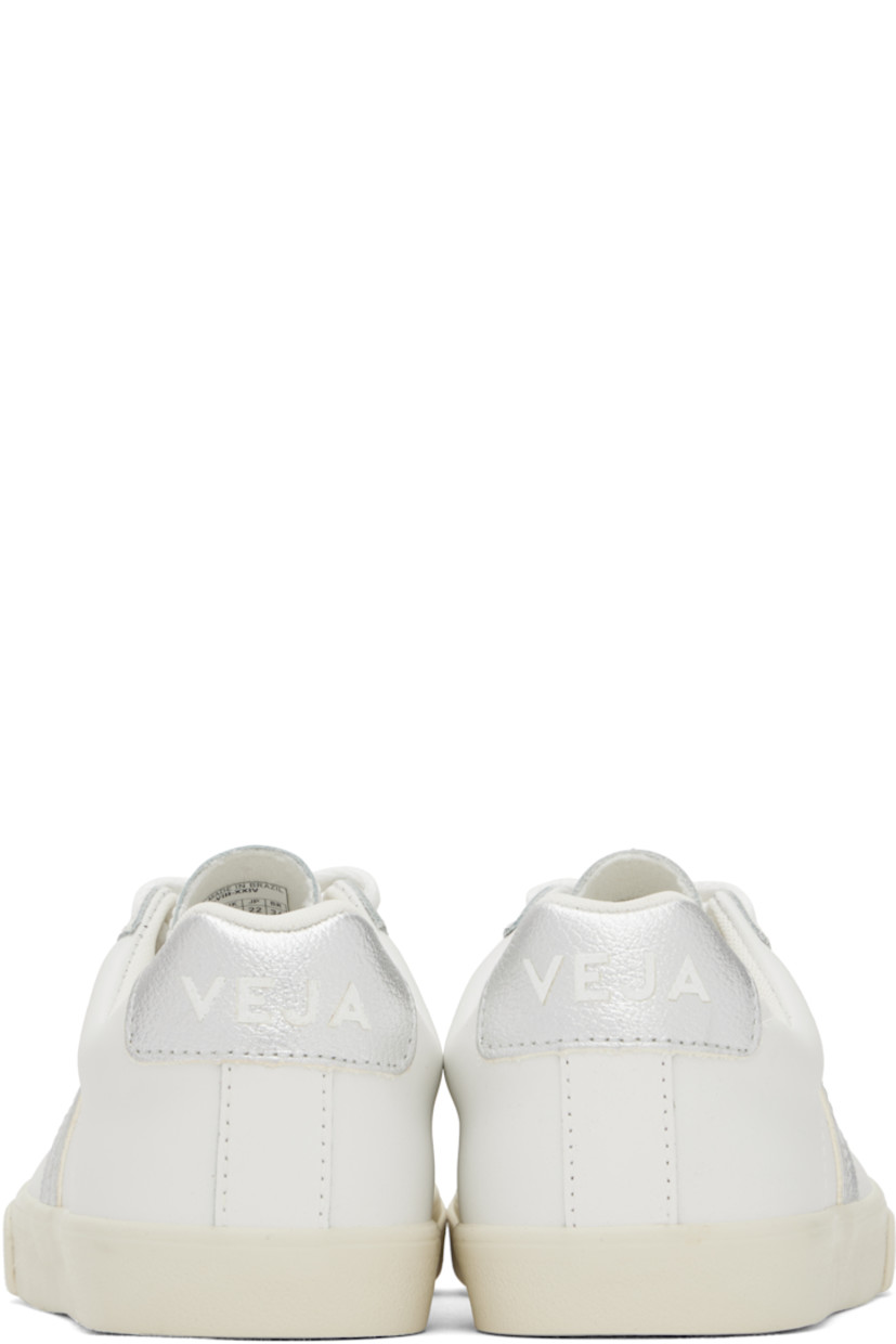 Low-top buffed leather sneakers in white. 

· Lace-up closure
· Logo printed at tongue
· Padded collar
· Logo appliqué at sides
· Logo printed at heel tab
· Recycled polyester jersey lining
· Treaded rubber sole

Supplier color: White/Silver