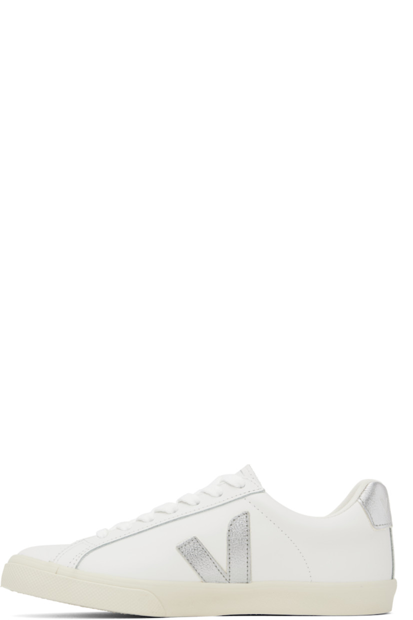 Low-top buffed leather sneakers in white. 

· Lace-up closure
· Logo printed at tongue
· Padded collar
· Logo appliqué at sides
· Logo printed at heel tab
· Recycled polyester jersey lining
· Treaded rubber sole

Supplier color: White/Silver