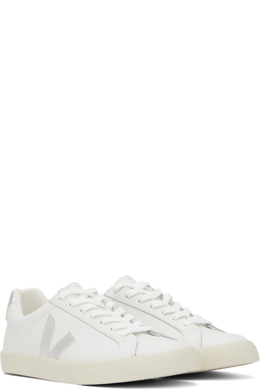 Low-top buffed leather sneakers in white. 

· Lace-up closure
· Logo printed at tongue
· Padded collar
· Logo appliqué at sides
· Logo printed at heel tab
· Recycled polyester jersey lining
· Treaded rubber sole

Supplier color: White/Silver